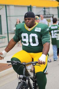 Green Bay Packers Nose tackle B.J. Raji rides a fans bicycle at pre season training camp, August 1, 2011, Green Bay, WI Green Bay Packers Nose tackle B.J. Raji rides a fans bicycle at pre season training camp August 1 2011 Green Bay WI 200x300 Green Bay Packers Nose tackle B.J. Raji rides a fans bicycle at pre season training camp, August 1, 2011, Green Bay, WI